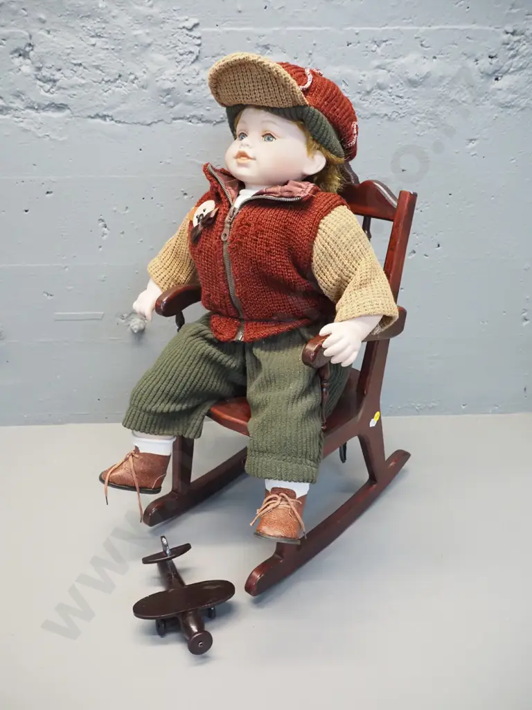 young boy doll on timber rocking chair with toy aeroplane - sitting as photographed H-620, chair D-400 Image 1++