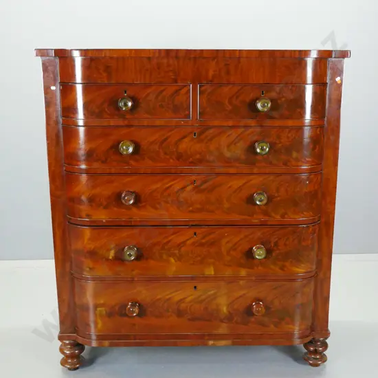 Victorian mahogany D-fronted 6-drawer chest with turned wooden knobs, cross-banded frieze, flame mahogany drawer fronts,