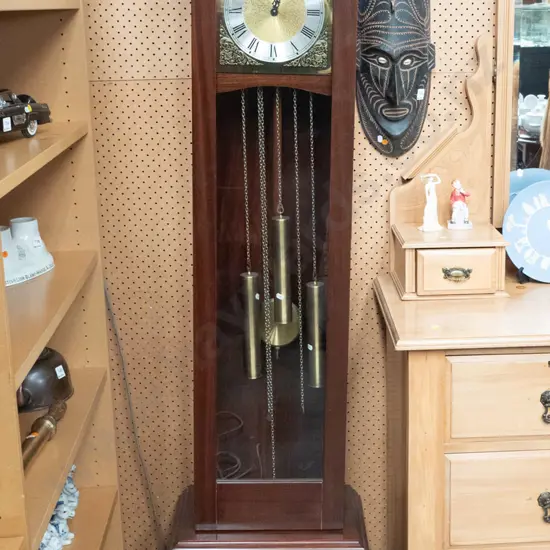 reproduction W. German walnut long-case clock with chiming movement, glazed door, brass and silver dial, w/Tempus Fugit