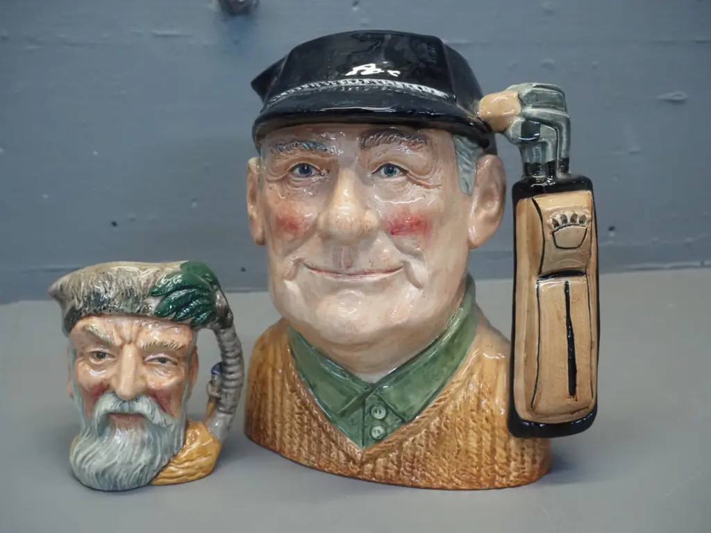2 Royal Doulton character jugs -  golfer H-210 and Robinson Crusoe Image 1++
