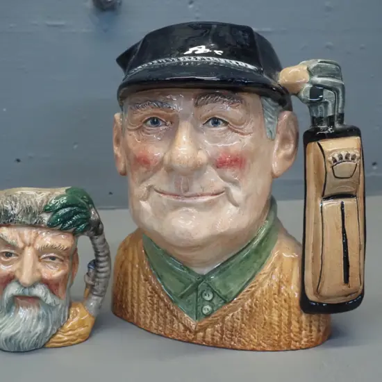 2 Royal Doulton character jugs -  golfer H-210 and Robinson Crusoe