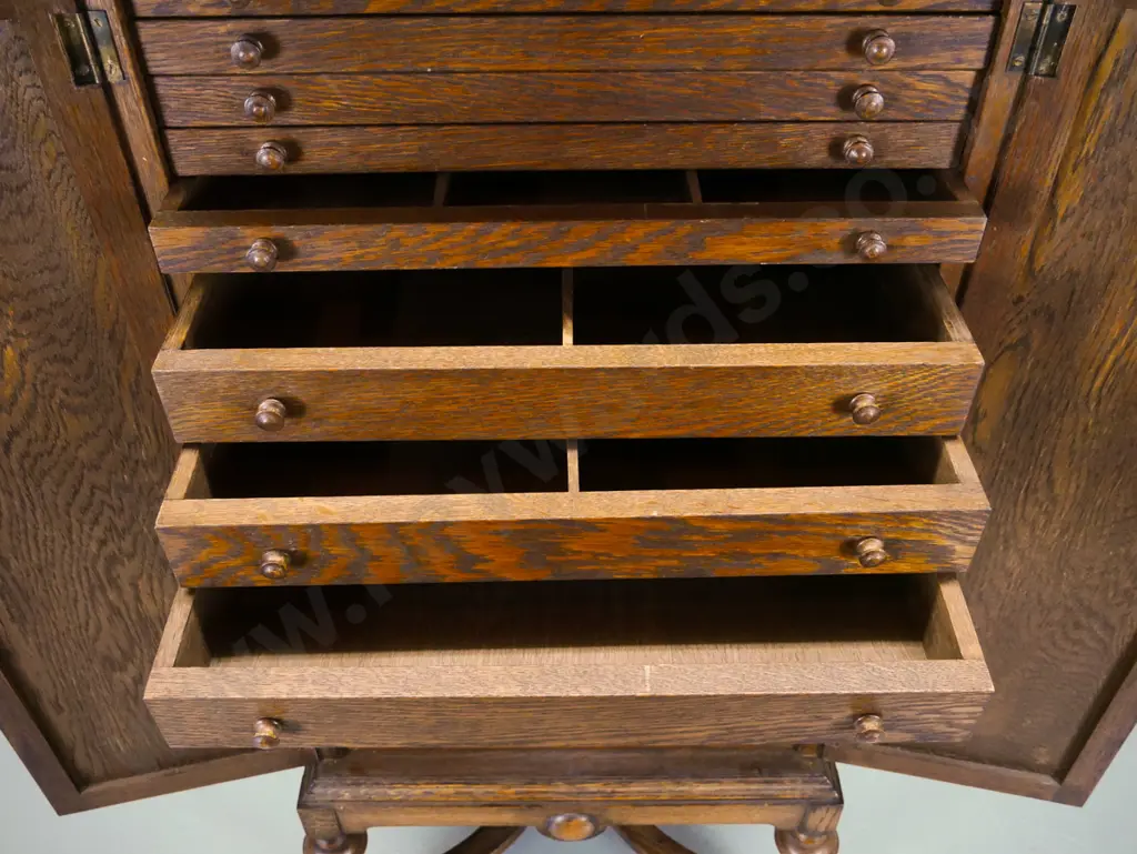 vintage oak cabinet with 2 panelled doors w/ drop handles, 14 interior drawers. some with partitions, panelled sides, on Image 1++
