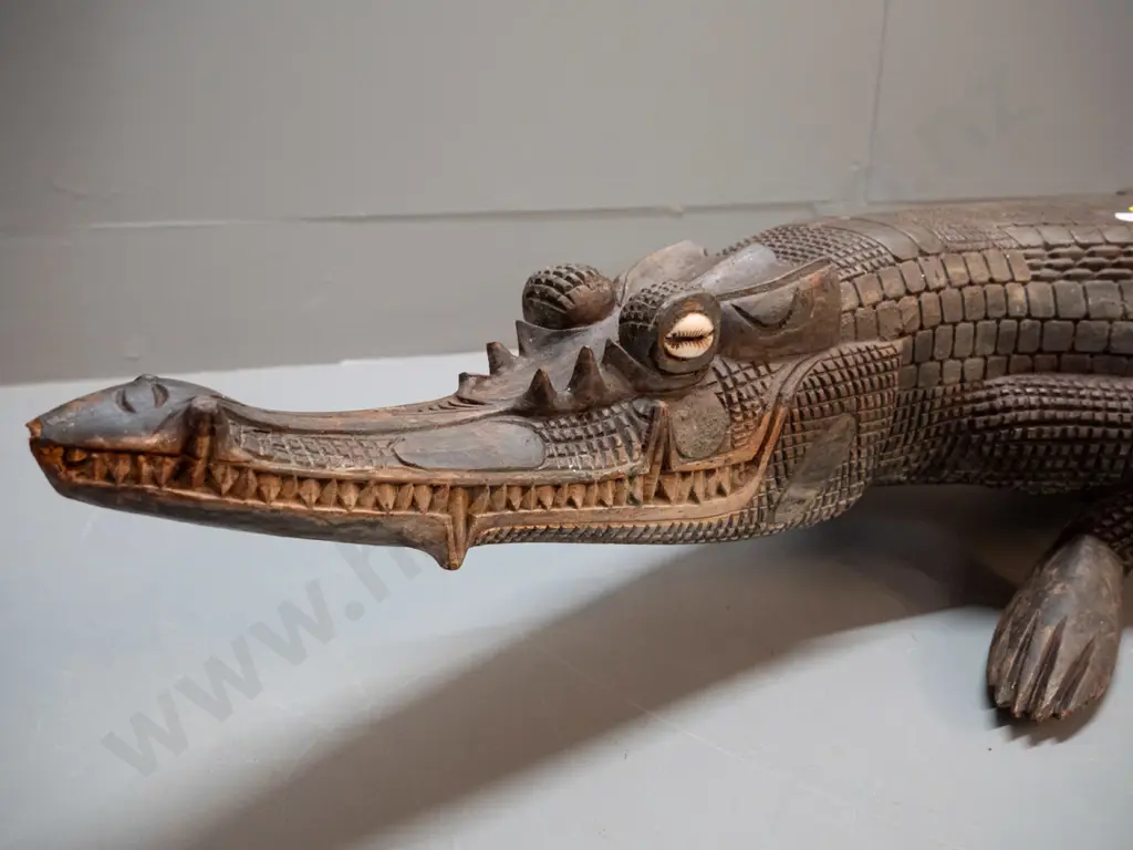 large carved timber crocodile with cowrie shell eye inserts - some chips and wear L-1070 W-250 at widest Image 1++