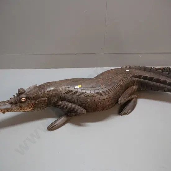 large carved timber crocodile with cowrie shell eye inserts - some chips and wear L-1070 W-250 at widest