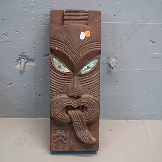 carved and stained timber Maori motif wall ornament with paua inset eyes - some chips and wear to paint H-360 W-120