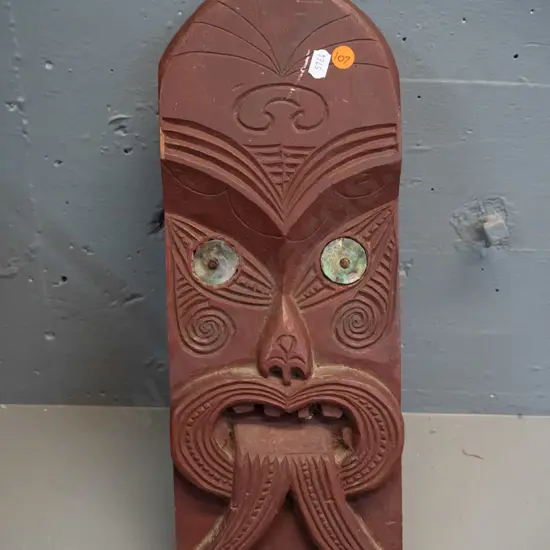carved and painted timber Maori motif wall panel with paua inset eyes - some chips and wear to paint, no hanger H-410