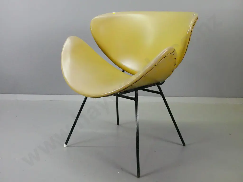 retro pale green lip chair with pitting and wear to finish on base, missing 3 leg caps, some fading, small nick to vinyl Image 1++
