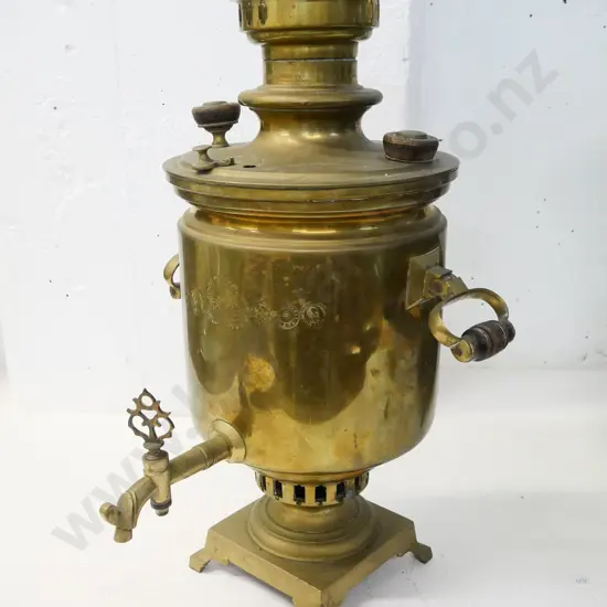 brass samovar with engraved logos in cyrillic, may be missing part of lid, has a few dents around handles H-480 W-300