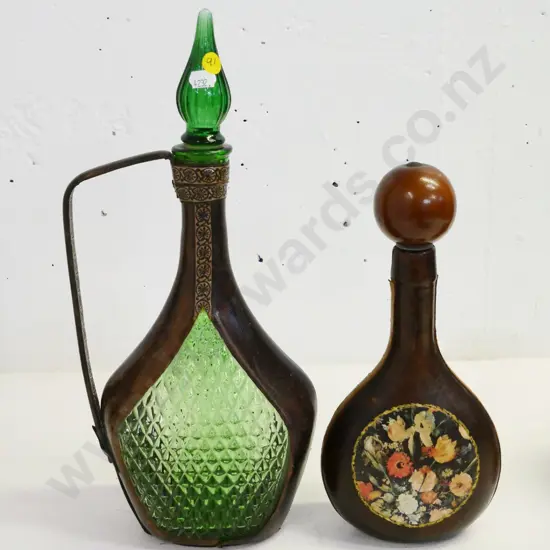 leather covered green glass items -  stoppered genie decanter H380 (some fraying to leather) and one with floral motif