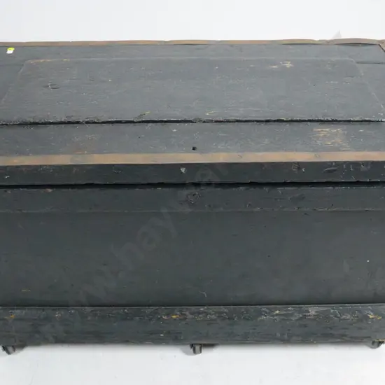 black painted timber chest with inset trays, brass catch and metal handles and binding, on casters H-510 W-880 D-480