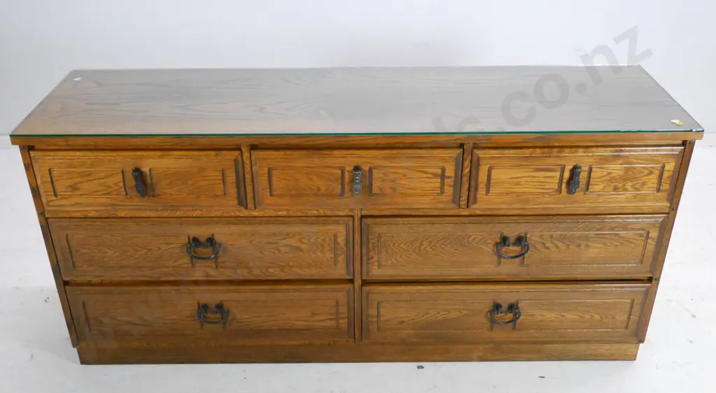 oak 7-drawer chest with mismatched cast metal drop handles and glass top H-670 W-1500 D-430 Image 1++