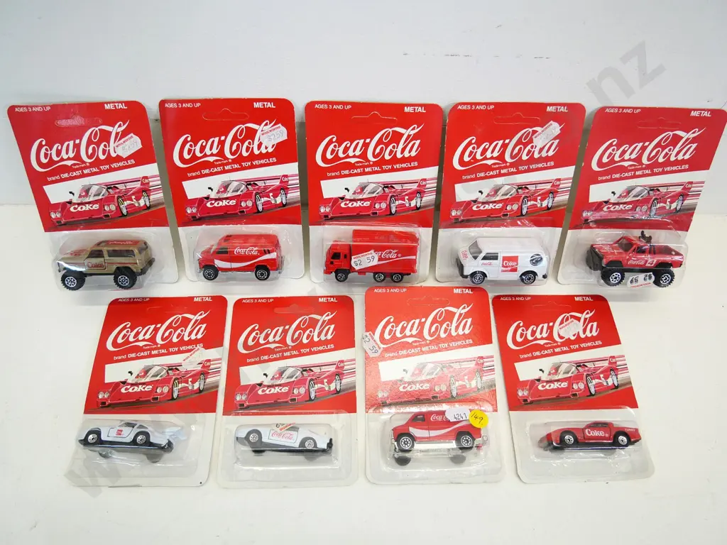9 small carded Coca-Cola branded die-cast model vehicles Image 1++