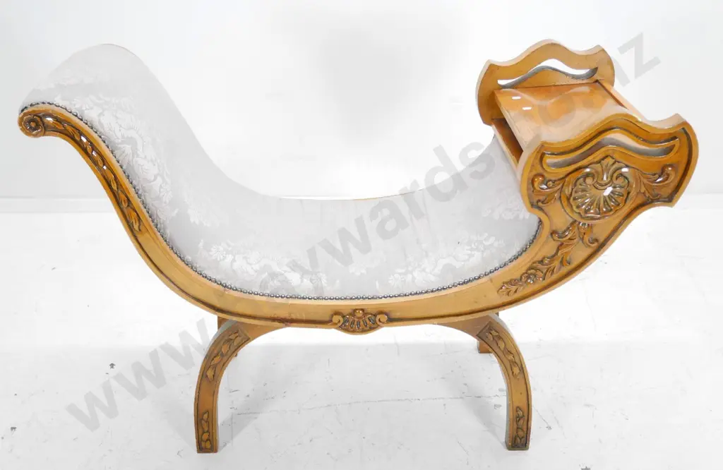 Empire-style (walnut?) seat with carved facings, studded upholstery, splitting to veneer on shelf end H820 W1170  D460 Image 1++