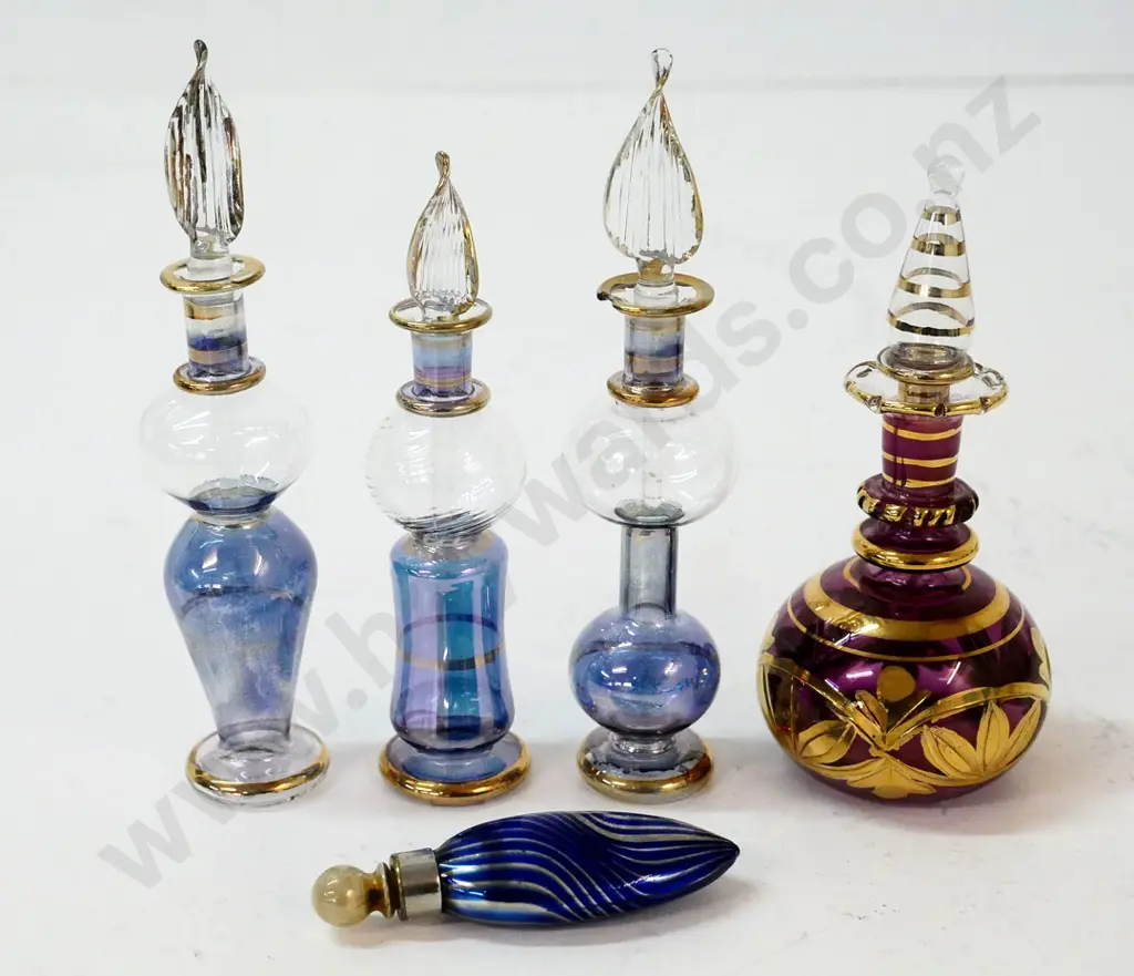 4 stoppered scent bottles, one with chip to rim (tallest H-135) and a blue stoppered scent/snuff bottle Image 1++