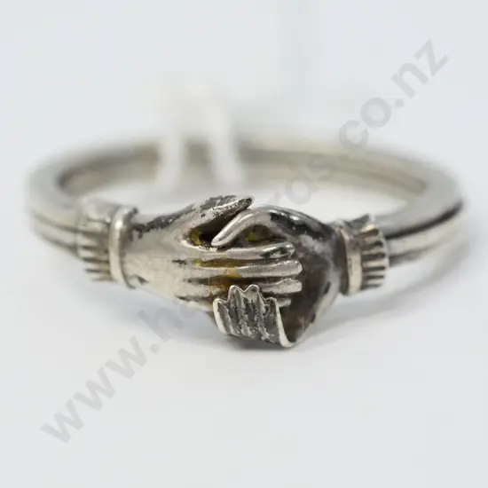 silver ring holding hands - no visible mark