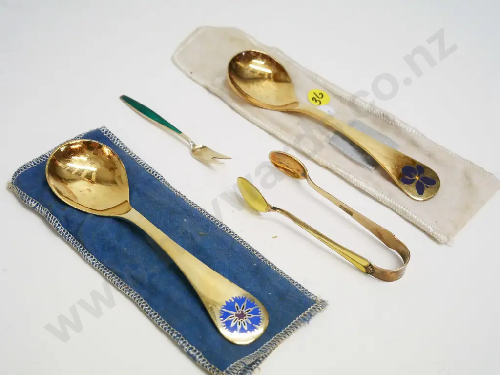 Norwegian gold-plated sterling silver & enamel items - 1976 & 1977 collector spoons, sugar tongs, small pickle fork Image 1++