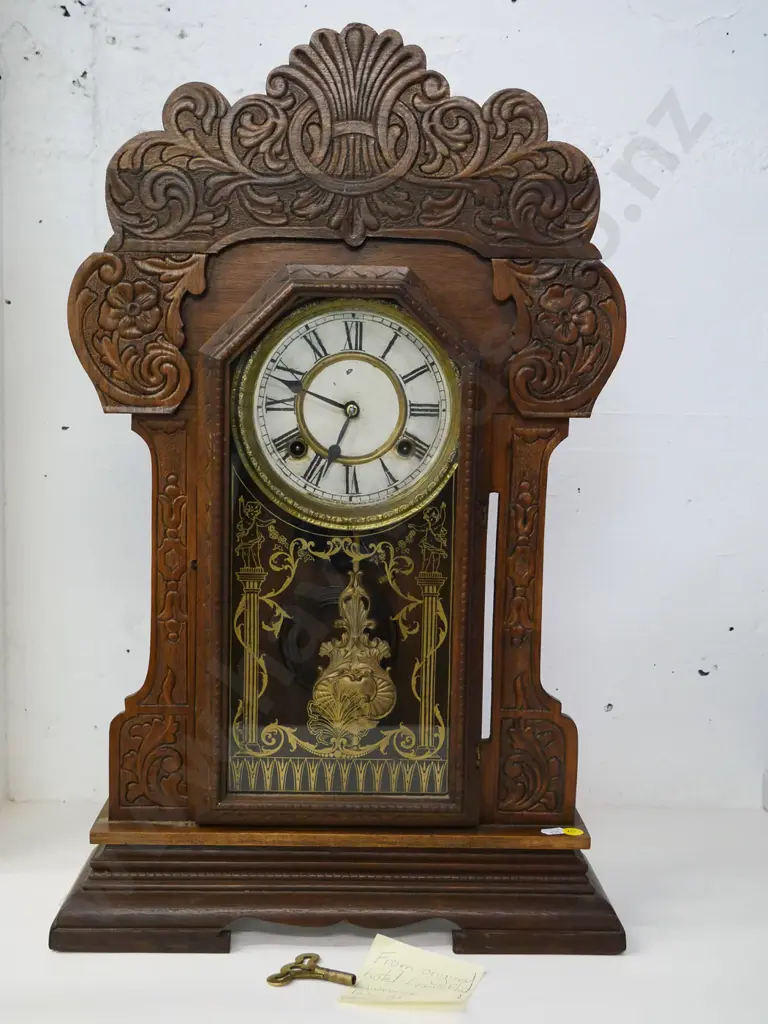 Ansonia wood-cased mantel clock with key, press-carved front, gilt glass decoration - from Evans Flat Hotel H-610 W-380 Image 1++