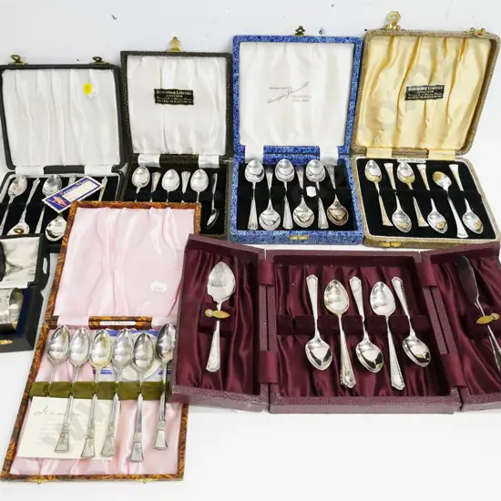 sterling silver napkin ring and 6 cased sets of plated teaspoons including 1 set apostle spoons. One has spoon missing
