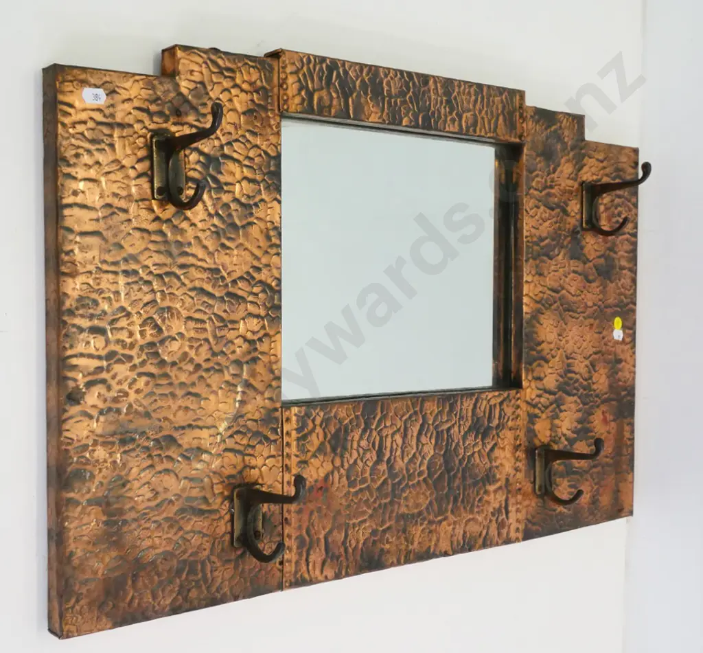 deco beaten copper framed wall mirror with 4 coat hooks - label on back: Made by A.T. Hart, Dunedin H-445 W-675 Image 1++