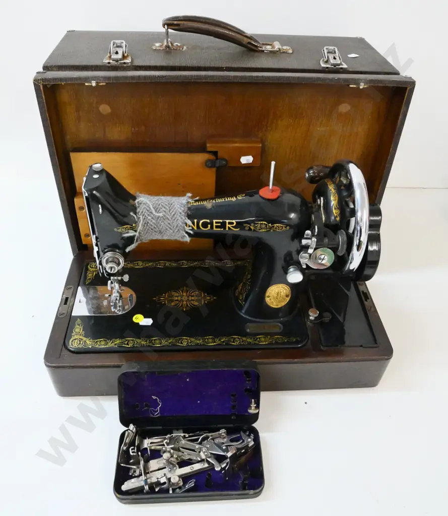 vintage portable cased Singer sewing machine in working order, with tin of attachments, some wear to case Image 1++