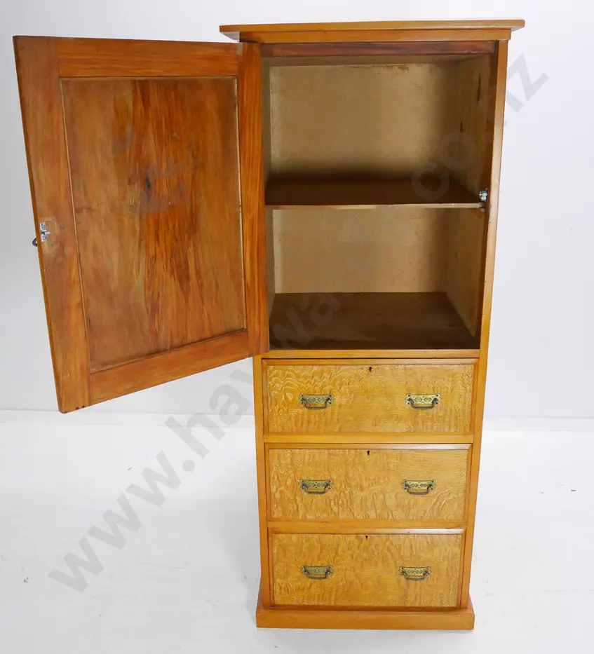 kauri chest w/cupboard, 3 drawers w/mottled veneer fronts, metal handles, split to top, borer in drawers Image 1++