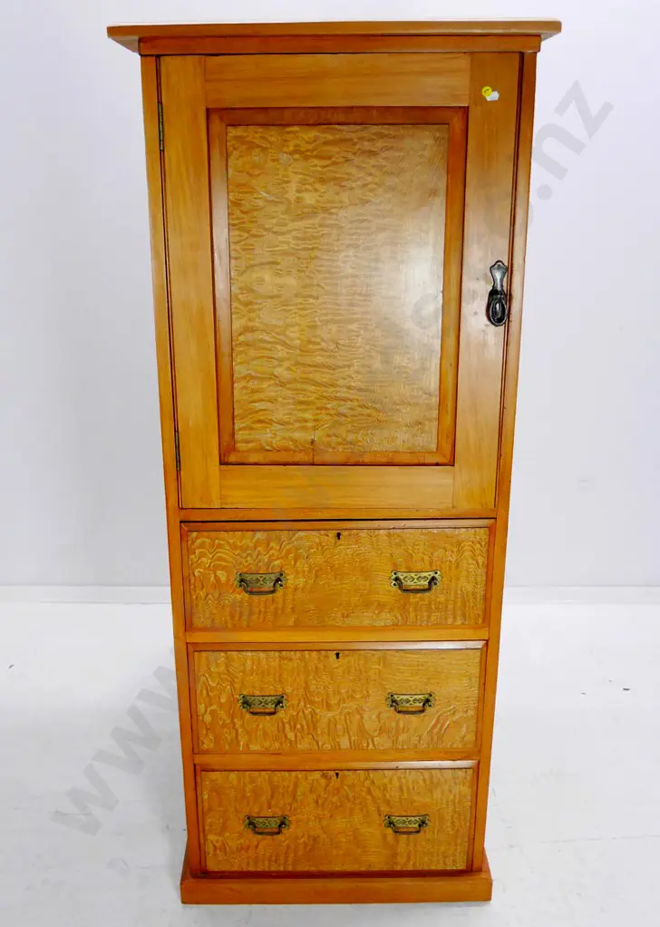 kauri chest w/cupboard, 3 drawers w/mottled veneer fronts, metal handles, split to top, borer in drawers Image 1++