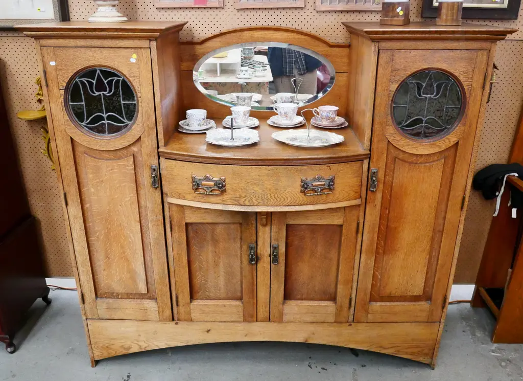 art deco sideboard with 2 stained glass and 2 solid doors, bevelled oval mirror, splits to some joins H1440 W1610 D470 Image 1++