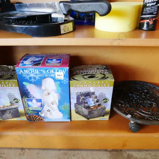 illuminated indoor fountain and sculpture, cast iron pot plant stand on casters