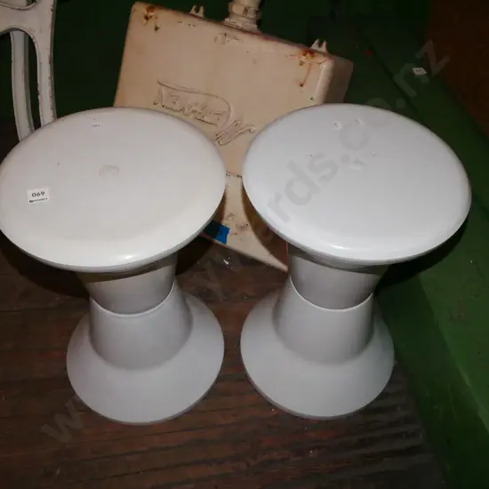 pair of plastic Caroma stools