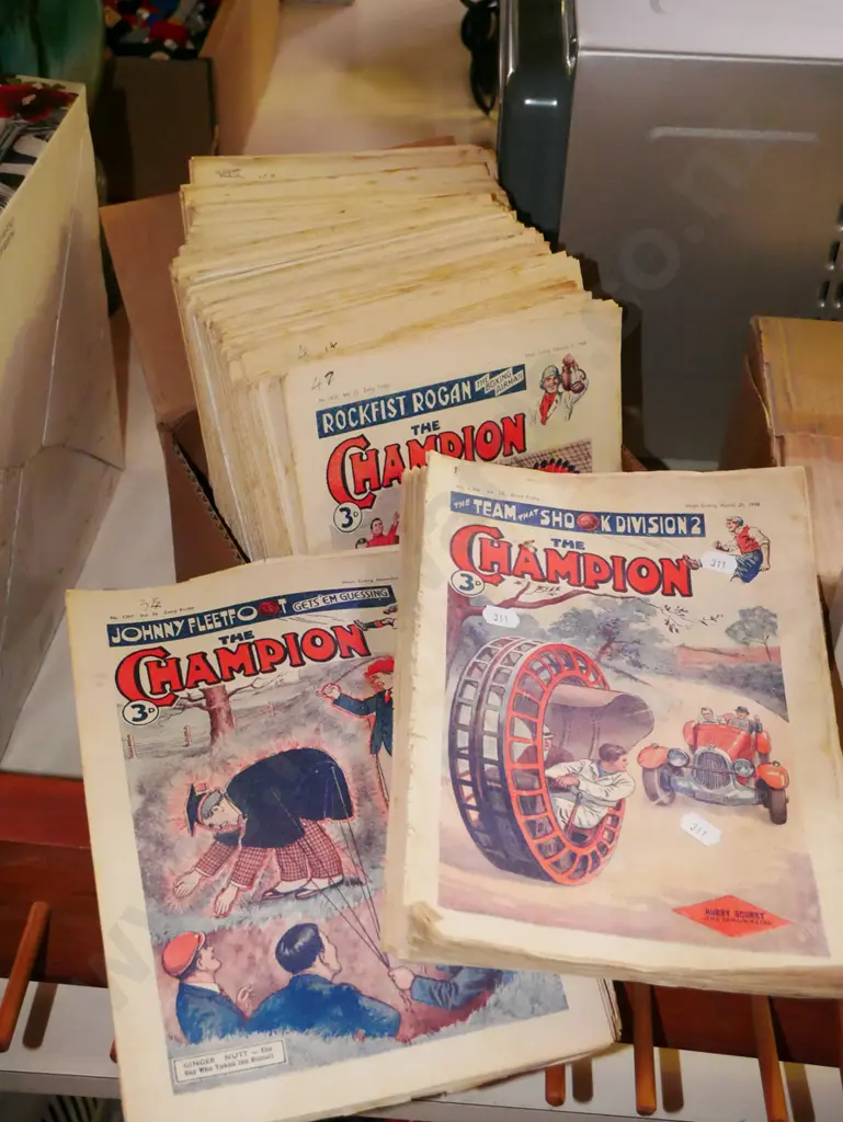 pile of vintage The Champion magazines Image 1++