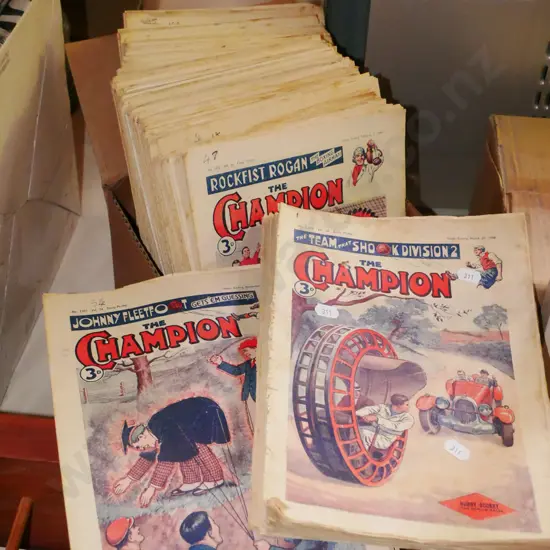 pile of vintage The Champion magazines