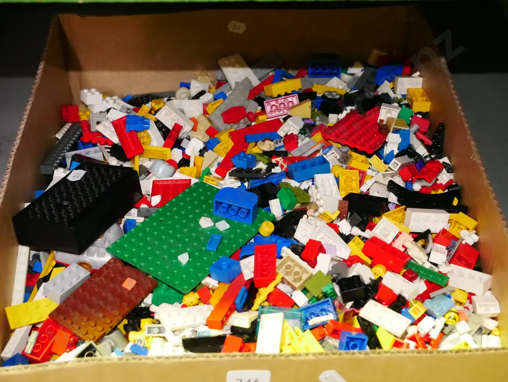 box of Lego pieces Image 1++