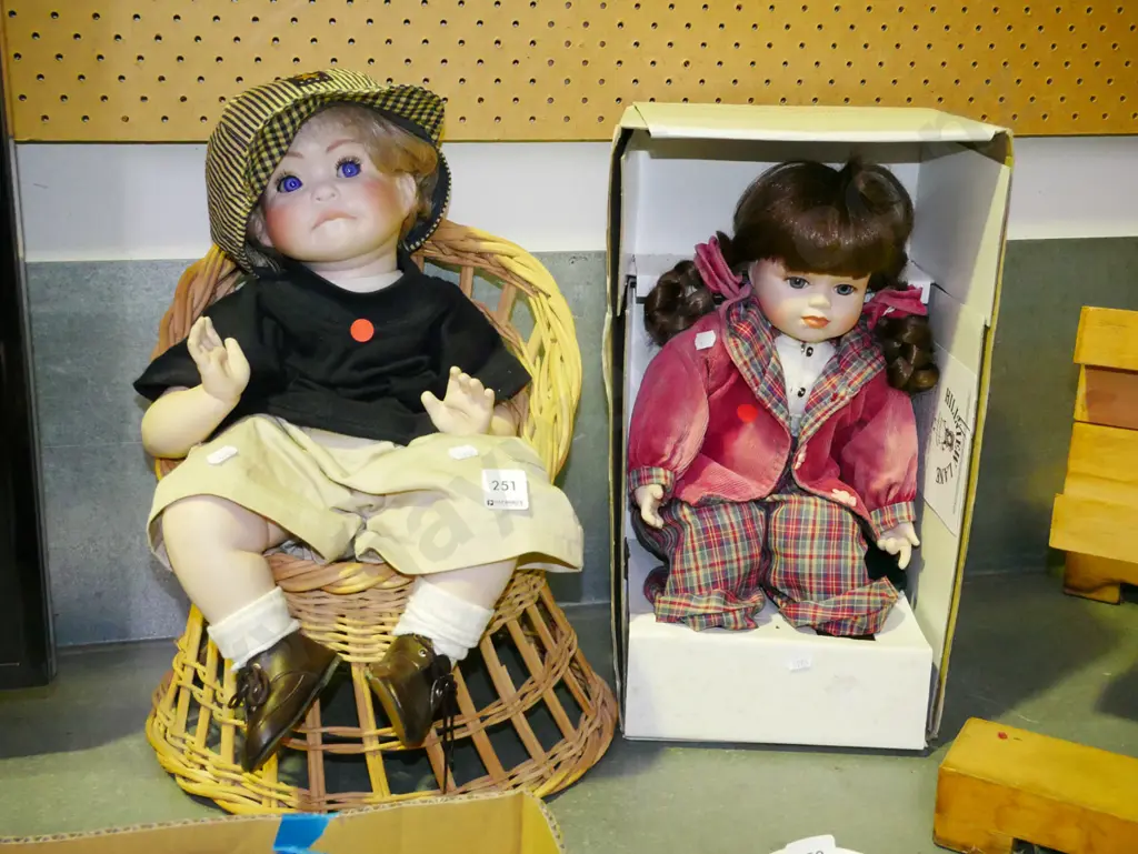 1x boxed Hillview Lane porcelain girl doll, 1x porcelain boy doll in chair -red dots Image 1++