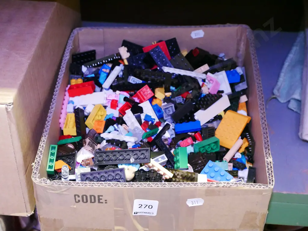 box of Lego pieces Image 1++