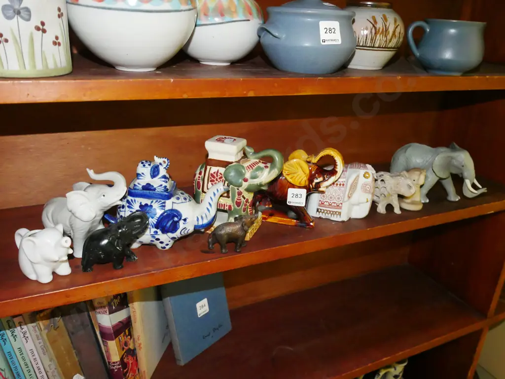 shelf of elephants figurines - some have damage Image 1++
