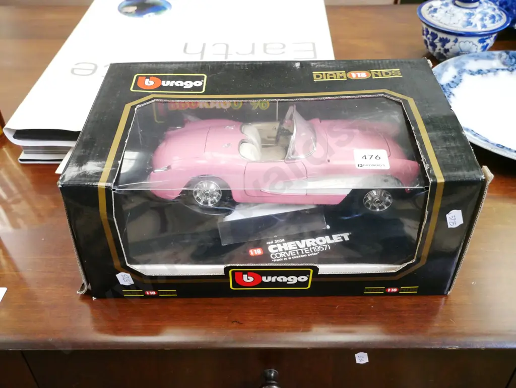 die cast Burago 1:18 scale model of model pink 1957 Corvette Image 1++