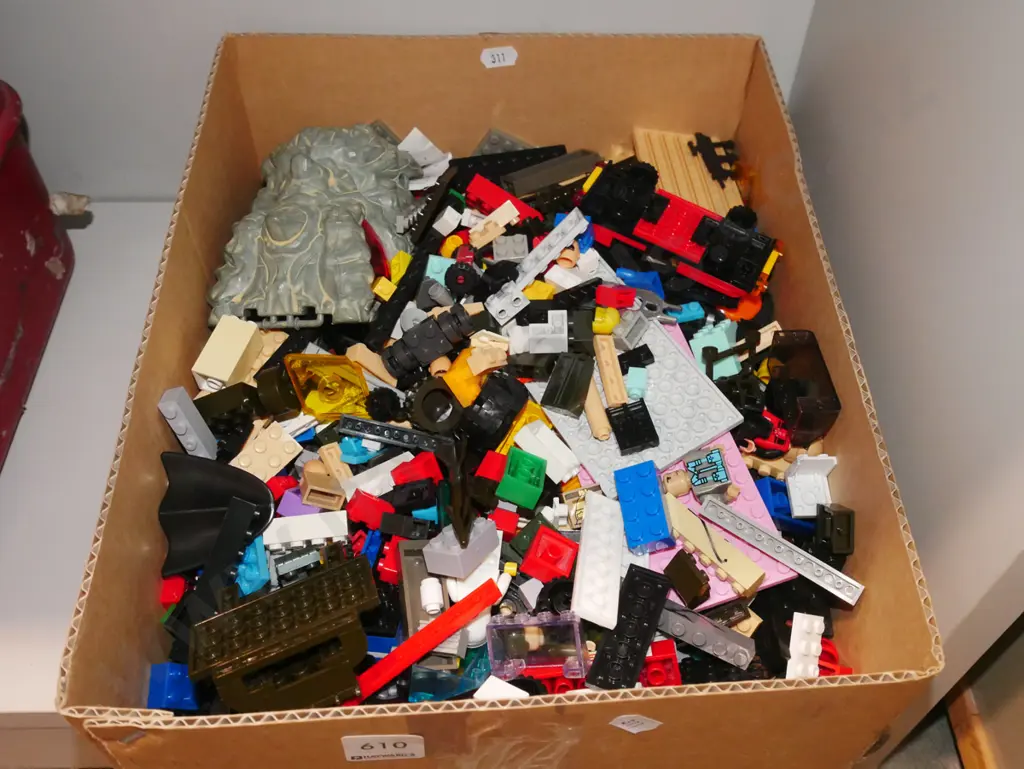 box of Lego pieces Image 1++