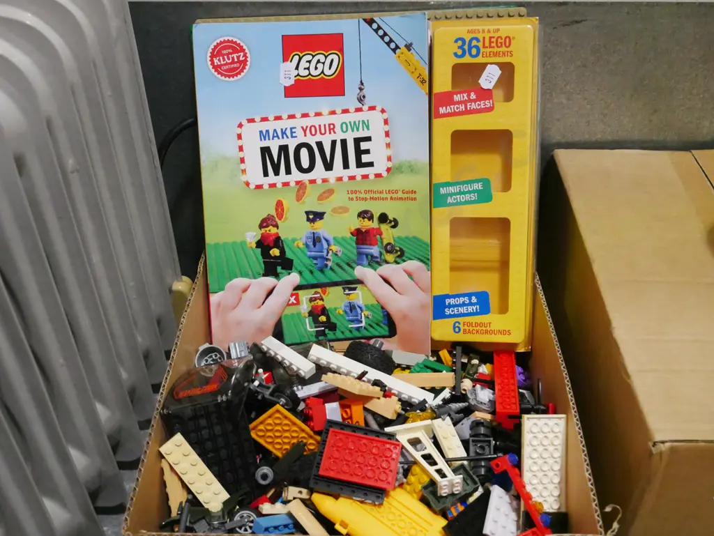 box of Lego pieces Image 1++