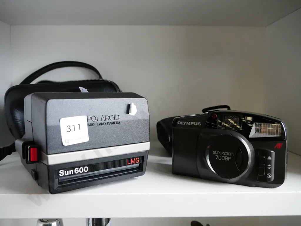 Polaroid land camera, Olmpus 35mm camera Image 1++