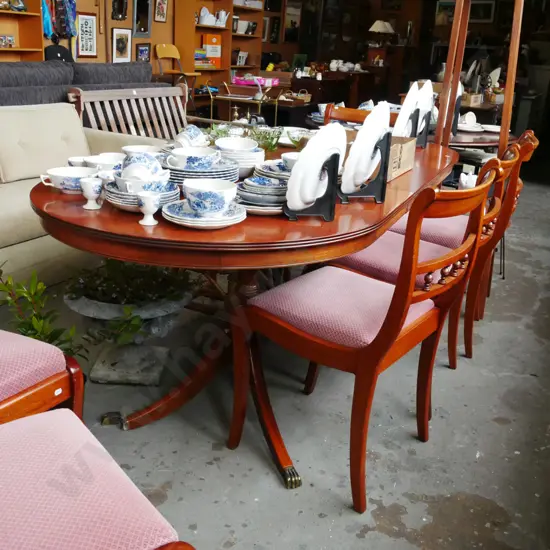 extending mahogany dining table with 6 spindleback chairs - 1 brass claw foot needs attention 