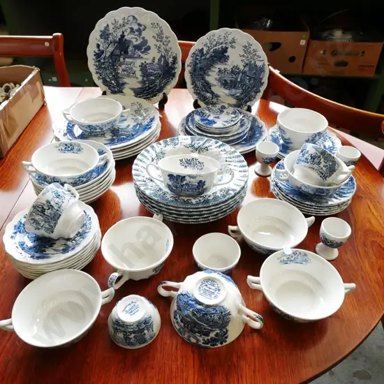 assorted blue and white items; plates, bowls, cups