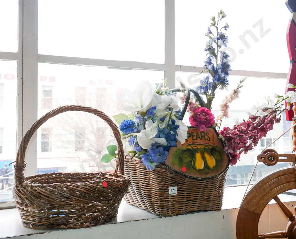 2x cane baskets, 1 has faux flowers and pierced picture Image 1++
