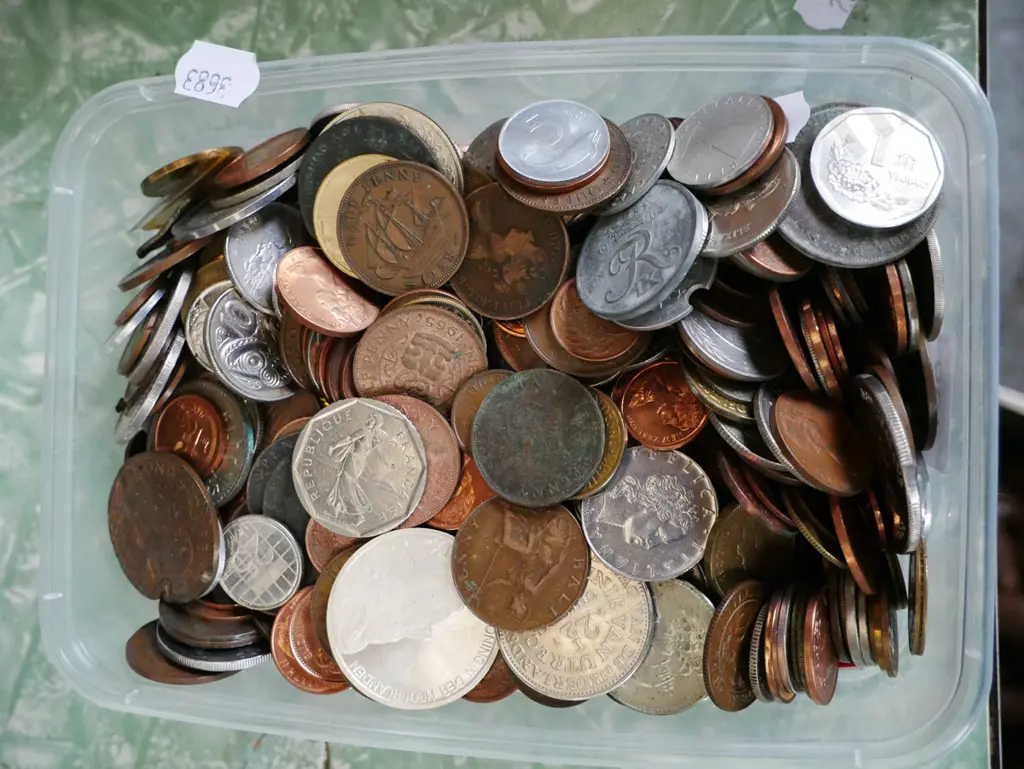 plastic container of coins Image 1++
