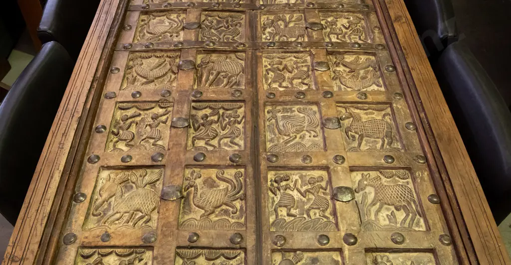  hardwood turned leg dining table with top made from 2 heavily carved temple doors and glass cover Image 1++