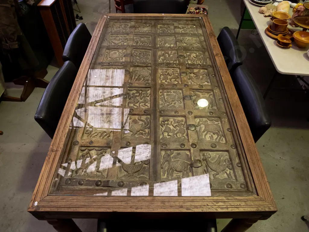  hardwood turned leg dining table with top made from 2 heavily carved temple doors and glass cover Image 1++