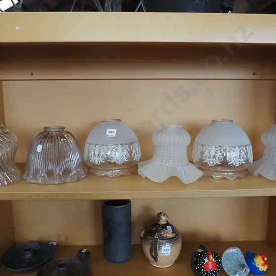 shelf of glass light shades