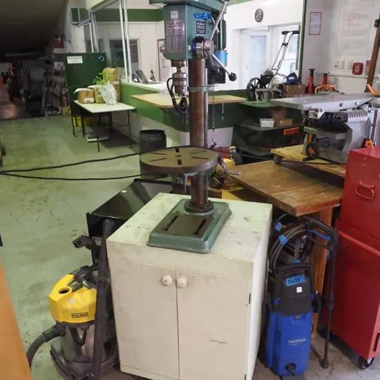 heavy duty drill press on 2-door cabinet with casters