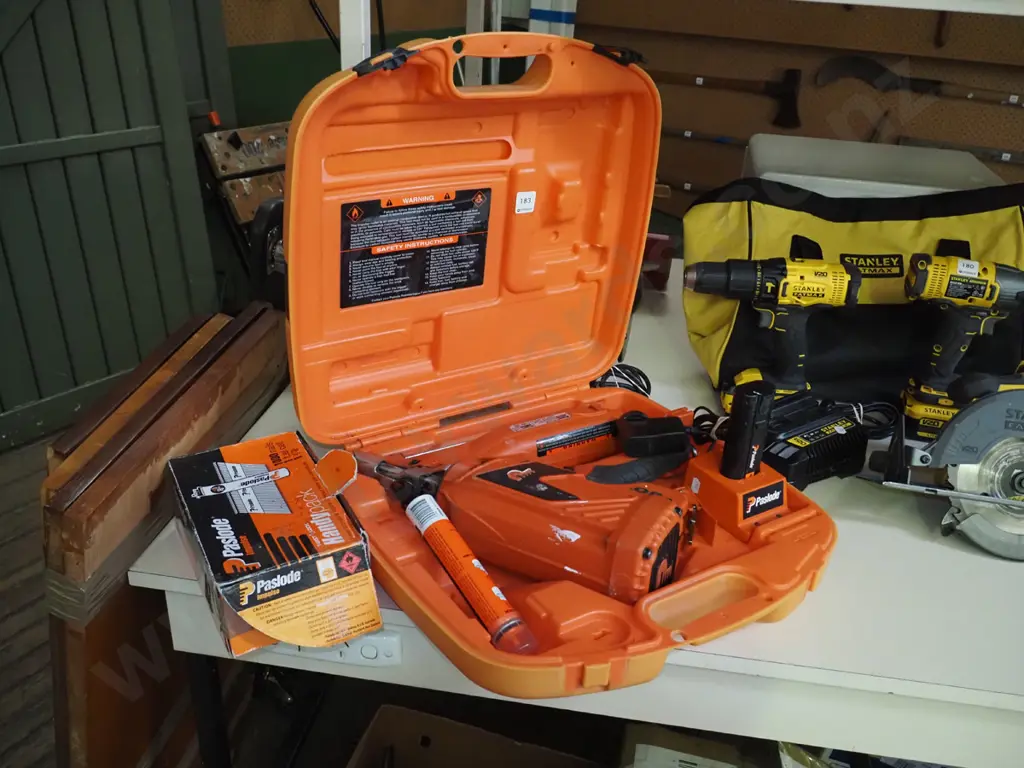 Paslode nail gun, carry case, part box of nails Image 1++