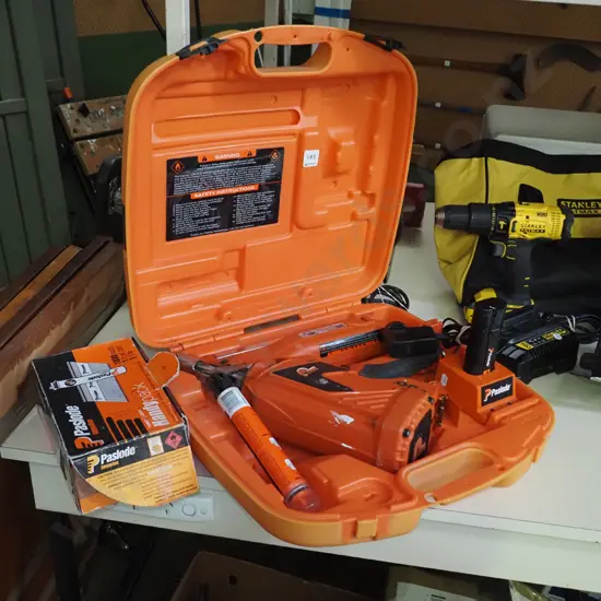 Paslode nail gun, carry case, part box of nails
