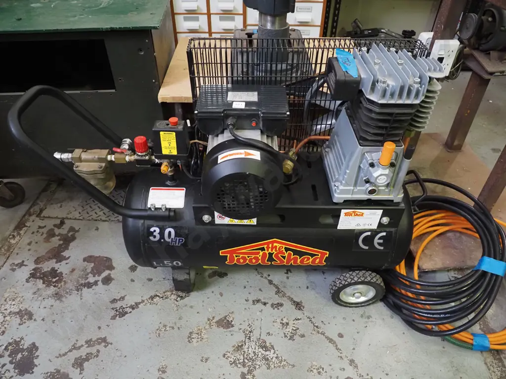 Toolshed 3 hp air compressor with orange and black air hoses Image 1++